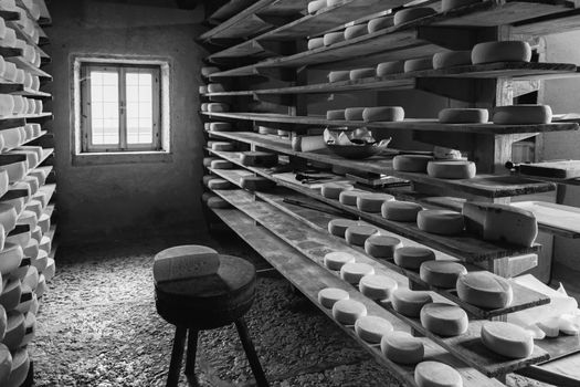 Alpine hut that produces and sells homemade cheeses.