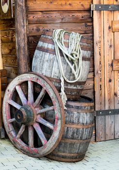 Barrels and wheel of a stagecoach in the old west.