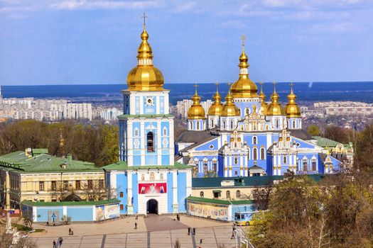 Saint Michael Monastery Cathedral Steeples Spires Tower Golden Dome Facade Kiev Ukraine.  Saint Michael's is a functioning Greek Orthordox Monasatery in Kiev.  The original monastery was created in the 1100s but was destroyed by the Soviet Union in the 1930s.  St. Michaels was reconstructed after Ukrainian independencein 1991 and reopened in 1999.