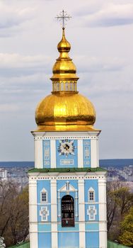 Saint Michael Monastery Cathedral Tower Golden Domes Kiev Ukraine.  Saint Michael's is a functioning Greek Orthordox Monasatery in Kiev.  The original monastery was created in the 1100s but was destroyed by the Soviet Union in the 1930s.  St. Michaels was reconstructed after Ukrainian independencein 1991 and reopened in 1999.