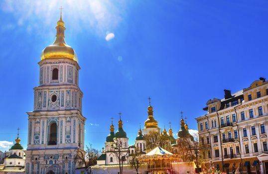 Saint Sophia Sofia Cathedral Spires Towe Golden Dome Under Sun Sofiyskaya Square Kiev Ukraine.  Saint Sophia is oldest Cathedral and Church in Kiev.  Saint Sofia was built by King Yaroslov the Wise in 1037.