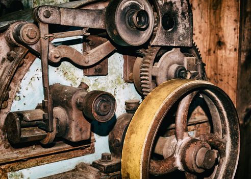 Detail of old vintage industrial production machine wheels