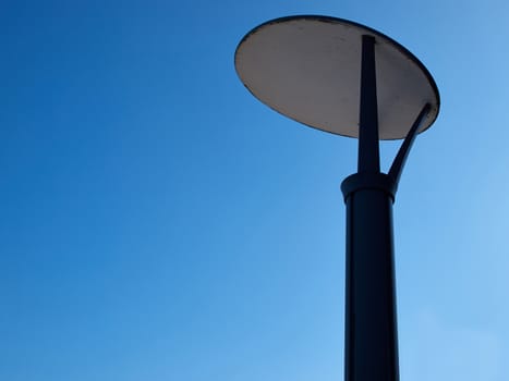 Modern design street light lamp post pole with clear summer blue sky