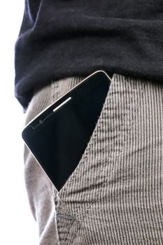 smart phone with a black screen in the pocket of jeans on white background
