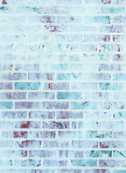 Whitewashed brick wall texture with blue and green hues