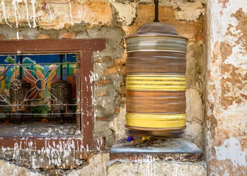 Spinning prayer wheel at Boudhanath stupa in Kathmandu, Nepal