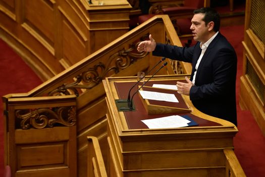 GREECE, Athens: Greek Prime Minister Alexis Tsipras addresses the plenary session of the Greek Parliament during the debate on the new austerity omnibus bill, in Athens, on October 16, 2015. The Greek Parliament approved with 154 votes of the total of 294 lawmakers present a new omnibus bill on prior actions requested by the country's lenders in order to release about 2 billion euros of bailout money.