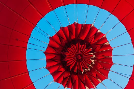Blue sky above the top of a red balloon in Bagan