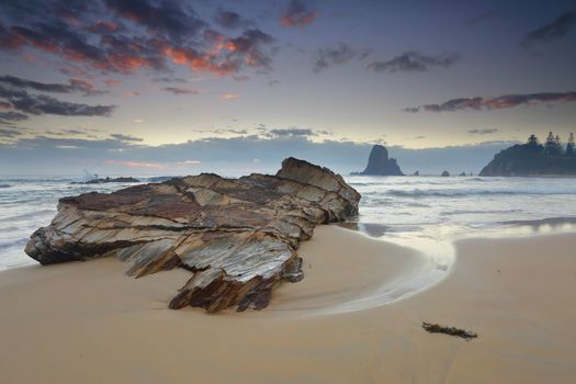 Windy morning along the Narooma cloastline.  In the foreground, one of the many rock formations around here at Glasshouse Rocks.  