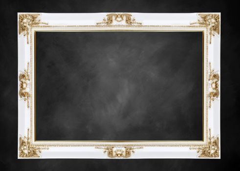 white and gold classical vintage frame on black chalkboard