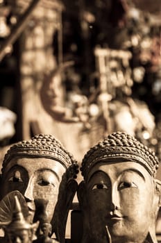 Two sepia buddha heads made of stone bagan myanmar