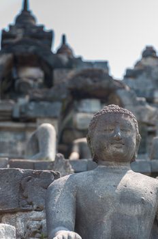 Sitting Buddha encarved in stone at Borobudur near Yogyakarta, Indonesia.