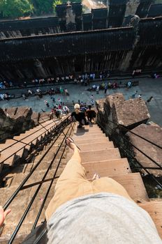 Person climbing down stairs POV at Angkor wat