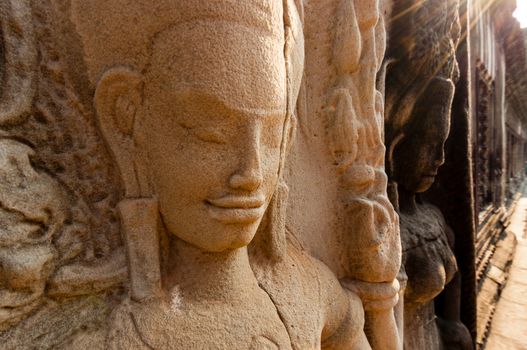 Detail of stone encarving Apsara at angkor wat