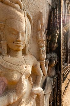Detail of stone encarving Apsara at angkor wat