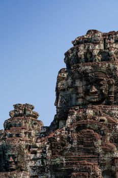 Head encarved in stone Bayon temple Angkor Wat Cambodia