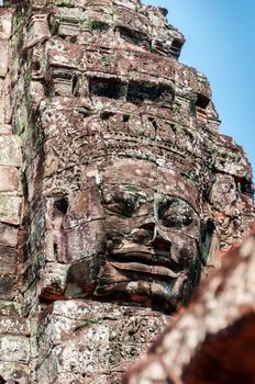 Head encarved in stone Bayon temple Angkor Wat Cambodia