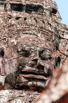 Head encarved in stone Bayon temple Angkor Wat Cambodia