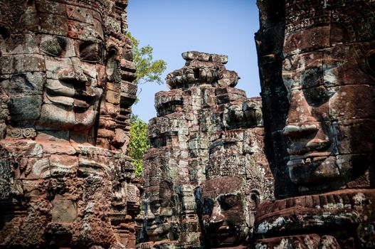 Head encarved in stone Bayon temple Angkor Wat Cambodia