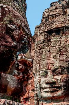 Head encarved in stone Bayon temple Angkor Wat Cambodia