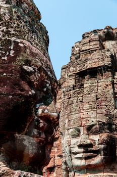 Head encarved in stone Bayon temple Angkor Wat Cambodia