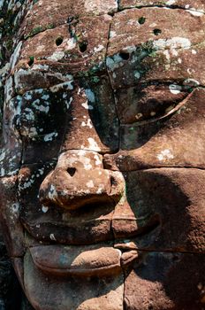 Head encarved in stone Bayon temple Angkor Wat Cambodia