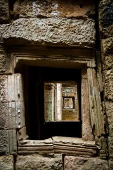 View through stone window at temples Angkor Wat