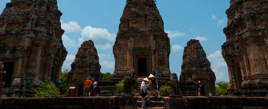 Five stone temples with people at Angkor Wat