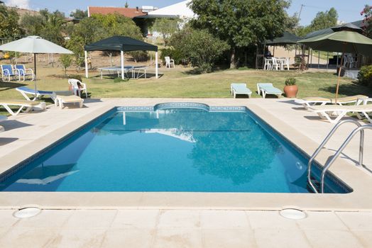tropical swimming pool in garden in Portugal Alentejo