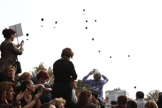 TRUKEY, Istanbul: Black balloons rise in the sky as hundreds demonstrate in Kadikoy, eastern Istanbul, on October 17, 2015, one week after the Ankara suicide attacks, to pay tribute to the victims.
