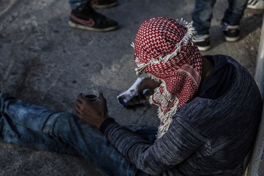 WEST BANK, Ramallah: A Palestinian gets some rest during clashes between the Israeli army and Palestinian youth near the Israeli settlement of Beit El in the West Bank on October 16, 2015.