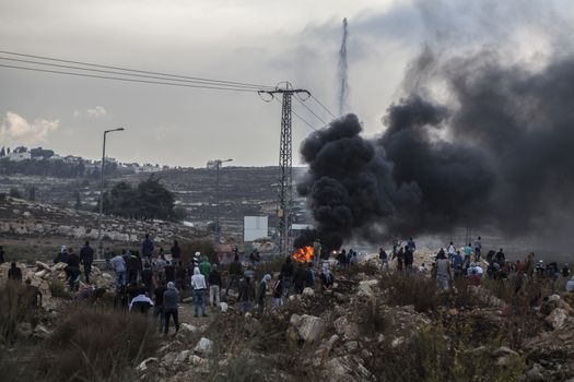 WEST BANK, Ramallah: Palestinian youth clash with the Israeli army near the Israeli settlement of Beit El in the West Bank on October 16, 2015.