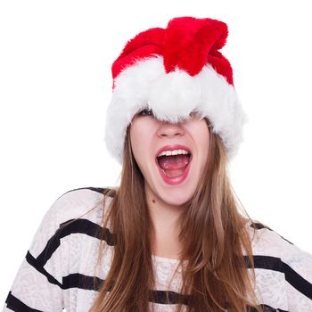 Expressive emotional girl in a Christmas hat on a white background. isolate