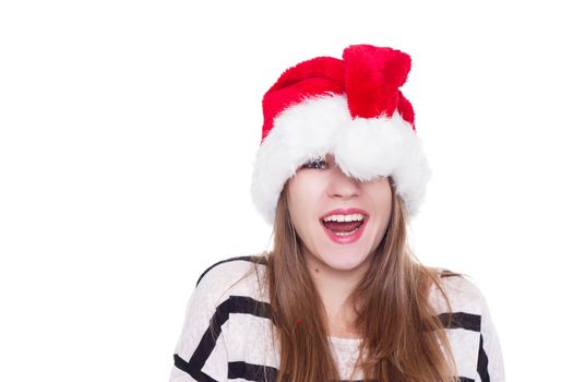 Expressive emotional girl in a Christmas hat on a white background. isolate