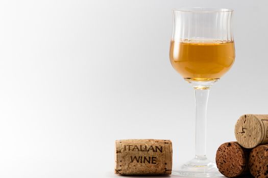 The italian wine on a withe background and corks