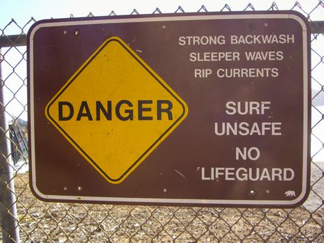 Surf warning sign in California coast