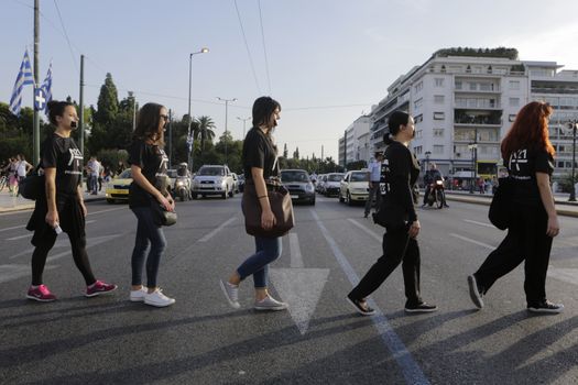 GREECE, Athens: Athens residents protest human trafficking by participating in the Walk for Freedom, a global initiative by the A21 Campaign, on October 17, 2015. The walk was one of several held worldwide by the organisation, which aims to raise awareness of human trafficking and provide support to survivors.  	