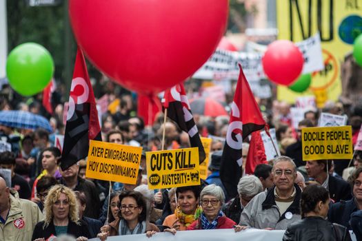 SPAIN, Madrid: Hundreds attend a protest against the Transatlantic Trade and Investment Partnership in Madrid, Spain on October 17, 2015. Leaders are still reaching an agreement on the TTIP, a deal designed to boost the US economy and European Union by removing tariffs and other barriers to trade and foreign investment. Protesters argue the TTIP will support corporations at the expense of citizens, increase poverty and inequality and harm the environment. 