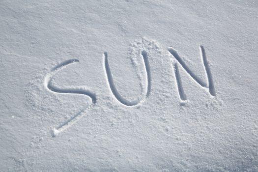 The word SUN written in the snow