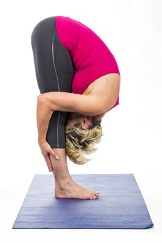 middle age woman doing yoga exercises