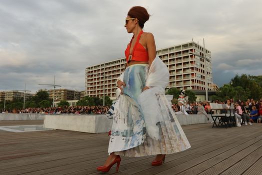 GREECE, Thessaloniki: A quirky outdoor fashion show with clothing made of recycled materials was held on the seafront promenade of Thessaloniki, northern Greece on September 28, 2015.	Professional designers, amateurs, fashionistas, architects and artists inspired by the city, the sea, the sky, the light and the colors of the New Promenade made unique creations from worthless items and recycled fabrics.