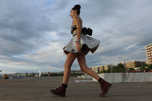 GREECE, Thessaloniki: A quirky outdoor fashion show with clothing made of recycled materials was held on the seafront promenade of Thessaloniki, northern Greece on September 28, 2015.	Professional designers, amateurs, fashionistas, architects and artists inspired by the city, the sea, the sky, the light and the colors of the New Promenade made unique creations from worthless items and recycled fabrics.