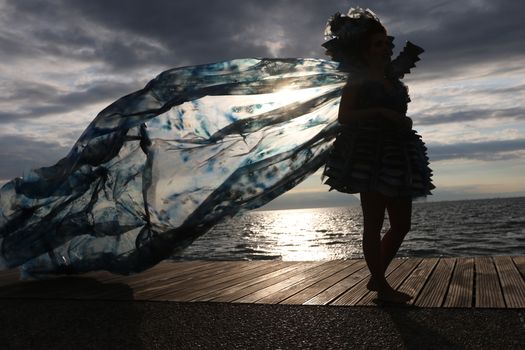 GREECE, Thessaloniki: A quirky outdoor fashion show with clothing made of recycled materials was held on the seafront promenade of Thessaloniki, northern Greece on September 28, 2015.	Professional designers, amateurs, fashionistas, architects and artists inspired by the city, the sea, the sky, the light and the colors of the New Promenade made unique creations from worthless items and recycled fabrics.