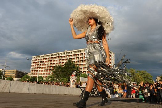 GREECE, Thessaloniki: A quirky outdoor fashion show with clothing made of recycled materials was held on the seafront promenade of Thessaloniki, northern Greece on September 28, 2015.	Professional designers, amateurs, fashionistas, architects and artists inspired by the city, the sea, the sky, the light and the colors of the New Promenade made unique creations from worthless items and recycled fabrics.