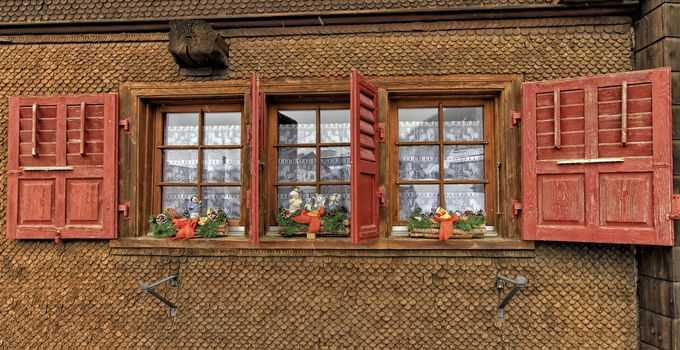 Chalet with shutters red and Christmas decorations