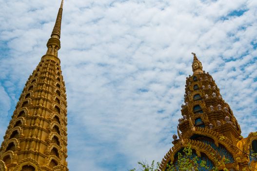 Golden Tops in front of beautiful blue and cloudy sky in Asia