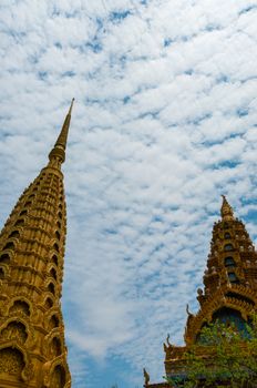 Golden Tops in front of beautiful blue and cloudy sky in Asia