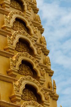 Golden Top detail in front of beautiful blue and cloudy sky in Asia