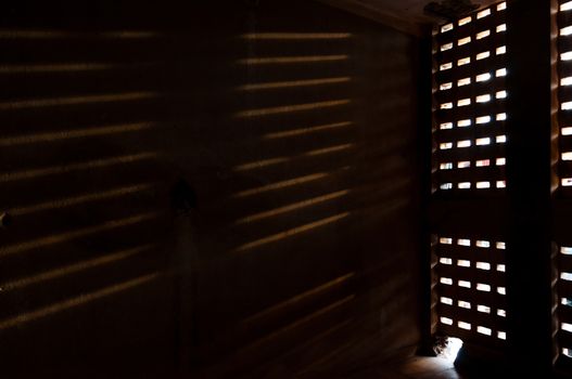 Light falling trough a window on a wall at Tuol Slen in Phnom Penh Cambodia