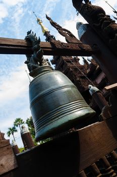 Big bell at wooden temple in Mandalay Burma Myanmar